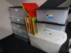 A quantity of plastic storage boxes