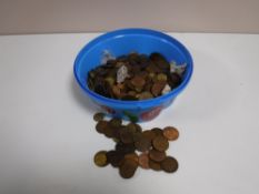 A tub containing a quantity of pre-decimal copper coinage