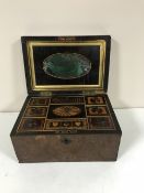 A Victorian inlaid walnut workbox with fine detailed interior