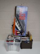 A boxed Casio electric keyboard together with a box of 7