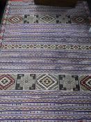 A hand stitched fringed rug