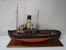 A remote control model boat on wooden stand 'Earl Grey,