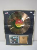 A brass framed gold disk Bob Dylan Desire