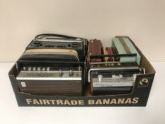 A box of nine vintage radios including Roberts,