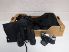 A box containing assorted cameras,