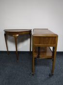 A walnut two-tier dumb waiter trolley together with a walnut D-shaped hall table