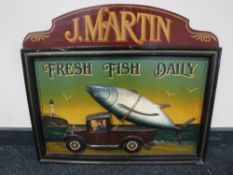 A wooden J Martin Fresh Fish Daily sign