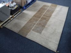 A contemporary brown rug