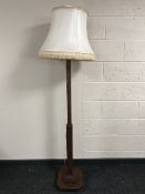 An oak standard lamp with shade