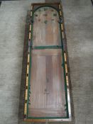 An antique mahogany folding bar skittles table