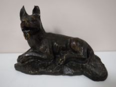 A bronze figure of an Alsatian