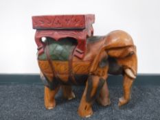 A painted wooden elephant plant stand