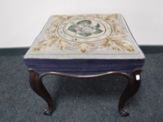 A mahogany tapestry upholstered stool on cabriole legs, in the 18th century style, width 51cm.