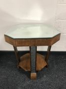 An octagonal walnut two-tier mirrored top Art Deco occasional table