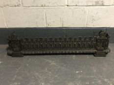 An early 20th century cast iron fender