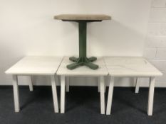Three square Ikea pine cafe tables together with a pine topped pedestal cafe table