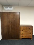 An oak double door hanging wardrobe together with an Edwardian pine five drawer chest
