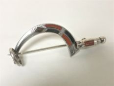 A 19th or early 20th century possibly continental silver wheatsheaf sickle brooch decorated with