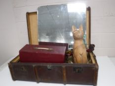 An early 20th century wooden bound trunk containing a dressing table mirror, cased sewing machine,
