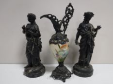 A pair of spelter figures on marble bases together with a spelter and china hand-painted ewer