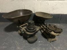 Two sets of antique grocer's scales with weights