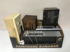 A box containing eight vintage radios including Roberts etc