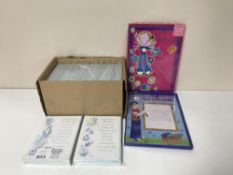 Approximately fifteen boxes containing assorted wrapping paper, greetings cards, certificates,