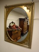 A Victorian style gilt framed oval mirror,