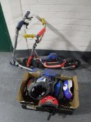 A Huffy Green Machine tricycle together with two scooters and a box containing assorted helmets