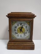 An oak cased American Ansonia mantel clock
