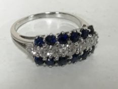 An 18ct white gold sapphire and diamond ring