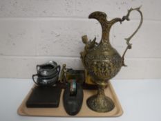 A tray containing a brass embossed ewer, brass mining figure, vintage tape dispenser,