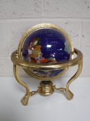 A gemstone table globe on brass stand