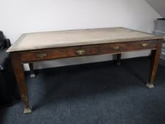 A late Victorian oak library table fitted two drawers