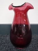 A Victorian cranberry glass vase