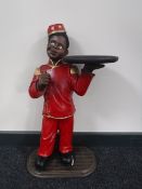 A painted figural wine table in the form of a waiter