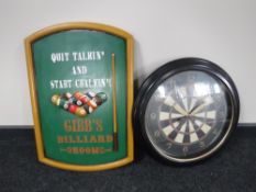 A wooden Gibbs billiard room sign together with a dart board wall clock