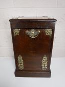 An antique mahogany coal receiver with brass mounts and liner