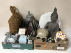 Two boxes containing rope boat buoys, cutlery, fishing reel, skull ornaments, figures,