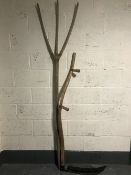 An early 20th century rustic hay fork together with a scythe
