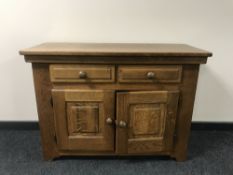 A contemporary oak double door sideboard fitted two drawers