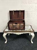 A mahogany Queen Anne style glass topped shabby chic coffee table together with a contemporary