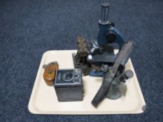 A tray containing live steam engine component, vintage blowtorch, Canco microscope,