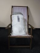 A folding wooden deck chair together with a Citroen car cover