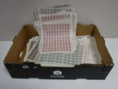 A box containing foreign stamp smiler sheets