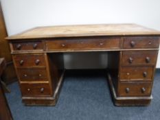 A Victorian mahogany twin pedestal desk fitted nine drawers