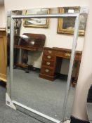 A contemporary panelled mirror,