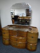 A shaped mid 20th century walnut dressing table