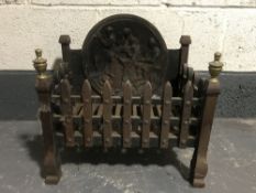 An early 20th century cast iron fire grate