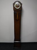 An oak cased granddaughter clock
